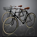 Vintage Black Bicycles With Red Seats Front Basket And Large Light Colored Tires