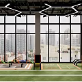 Modern Fitness Gym Interior With Large Windows City Skyline View Green Turf And Exercise Equipment
