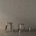 Stylish Modern Metal Stools With Various Sizes Arranged Against Concrete Wall Background