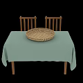 Simple Dining Table With Light Green Tablecloth Wicker Basket And Wooden Chairs