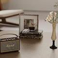 Vintage Marshall Speaker With Flowers In Vase On Books Over Wooden Table