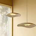 Modern Pendant Lights With Wavy Design Above Window With Blinds Soft Glow In Interior Space