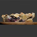 Delicious Blueberry Pastries with Flaky Golden Crust and Fresh Berries on Wooden Plate
