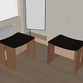 Two Modern Wooden Stools With Black Leather Seats And Brown Legs