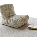 Cozy Floral Pattern Bean Bag Chair with Open Book on Soft Indoor Carpet