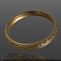 Gold Bracelet With Intricate Carved Patterns On Black Background With Reflection