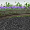 Curved Metal Landscape Bench With Striped Seat Purple Flowers And Stone Pavement