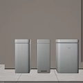 Three White Trash Bins Placed Against Wall On Light Colored Floor 3d model