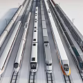 Various Modern Trains Lined Up On Parallel Rail Tracks With Silver White And Orange Designs
