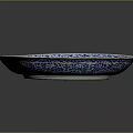 Plant Themed Decorative Pattern On Blue And White Ceramic Plate With Intricate Design