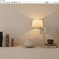 Minimalist Wall Sconce with White Shade Wooden Figurines White Vase and Books on Shelf