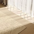 Square Woven Beige Rug in Sunlit Indoor Room with Curtains and Wooden Floor