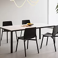 Modern Dining Table Set With White Top Black Legs And Four Black Chairs