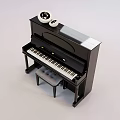 Black Upright Piano with Art Supplies on Top and Matching Piano Bench