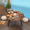 Outdoor Round Wooden Table on Poolside Deck with Food Fruits Lantern and Woven Cushions