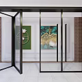 Modern Glass Folding Doors With Black Frame In Interior With Decorative Artwork And Tile Floor