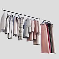 Various Styles Clothes Hanging On Hangers With Different Colors And Fashion Designs