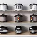 Assorted Kitchen Appliances on Wooden Shelves Featuring Electric Pressure Cookers and Rice Cookers