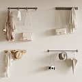 Stylish Clothes Hanging on Wall with Accessories Bags Hats Scarf and Camera