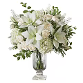 White Floral Arrangement With Lilies Roses Hydrangeas In Glass Vase And Green Leaves