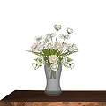 White Flowers Arrangement In Transparent Vase On Wooden Table With Light Background