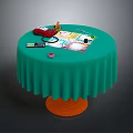 Round Table With Green Ruffled Tablecloth Orange Base And Board Game Setup