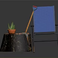Blue Outdoor Chair With Tree Stump Table Potted Plant And Shovel