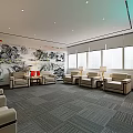 Elegant Hotel Public Lounge Area Featuring Comfortable Sofas Large Windows Green Plants And Landscape Art