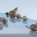 Wooden Garden Ornaments With Multiple Wheel Designs And Water Reflection In Blue Sky