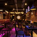 Industrial Bar Interior Design With Brick Walls Pendant Lights And Neon Signs