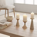 Minimalist White Candle Holders On Wooden Table With Open Book And Ceramic Bowl