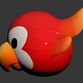 Red Orange Bird Toy With White Face Black Eyes On Black Surface With Reflection