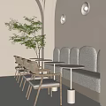 Café with Light Toned Walls Gray Curved Booths Round White Tables and Light Wooden Chairs