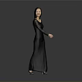 Elegant Woman In Black Long Dress With Lace Sleeves Standing Against Gray Background