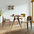 Round Wooden Dining Table Set With Three Chairs And Colorful Legs In Natural Light