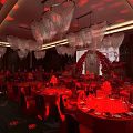Elegant Red Theme Banquet Hall With Red Carpet Roses Chandeliers Tables And Stage Arch