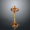 Ornate Golden Metal Decorative Stand With Intricate Carvings And Curved Base