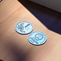 Silver Jewelry With Detailed Engraved Patterns Displayed On Wooden Table Surface