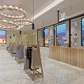 Elegant Clothing Store With Circular Chandeliers Herringbone Floor Large Windows And Clothes On Racks