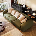 Green Upholstered Sectional Sofa With Beige Cushions In Living Room With Wooden Floor And Bookshelf