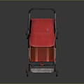 Red Baby Stroller With Red Canopy And Metal Frame On Reflective Surface
