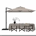 Outdoor Table with Linen Tablecloth and Wooden Chairs Under Large Cantilever Umbrella