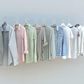 Stylish Hanging Clothes Various Styles Pastel Light Colors Shirts Denim Jackets T-shirts on Hangers