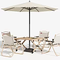 Outdoor Table Set With Four Chairs And A Beige Umbrella