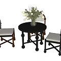 Round Dark Wooden Dining Table With Three Light Upholstered Chairs And White Flower Vase