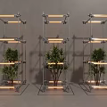Three Modern Metal Frame Columns With Illuminated Plants And Glass Base Design