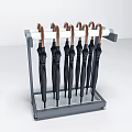 Sturdy Metal Umbrella Stand Holding Multiple Black Umbrellas For Home Use