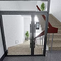 Modern Glass Door Entrance With Staircase Wooden Handrail And Indoor Plants