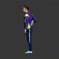 Man Doing Leg Stretch in Purple Active Top and Blue Pants Against Gray Black Background