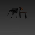 Modern Dining Chairs With Black And Brown Leather Seats Curved Backrests And Metal Legs